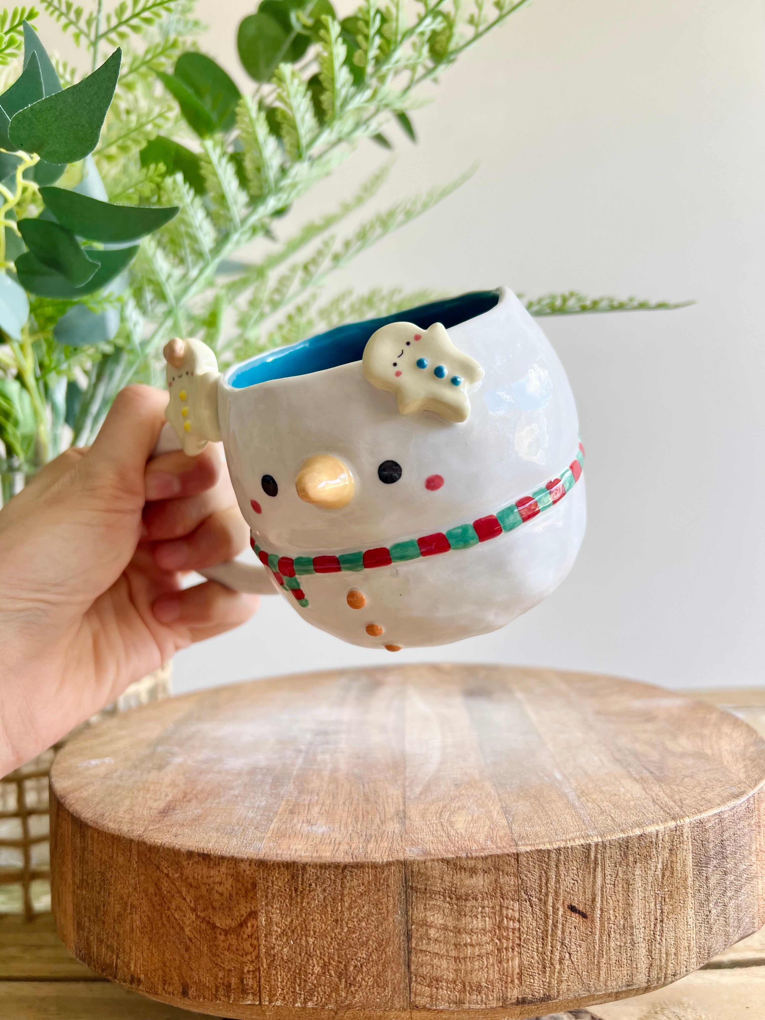 Snowman mug with gingerbread friends