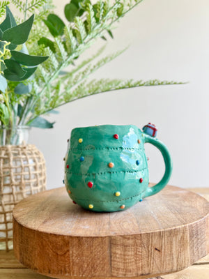 Christmas tree mug with grey cat and present friend