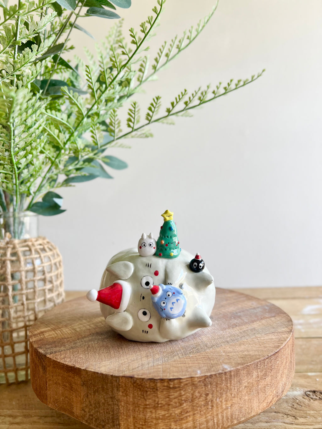 Festive sideways Totoro vase