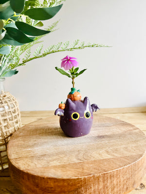 Bat with pumpkin friends bud vase