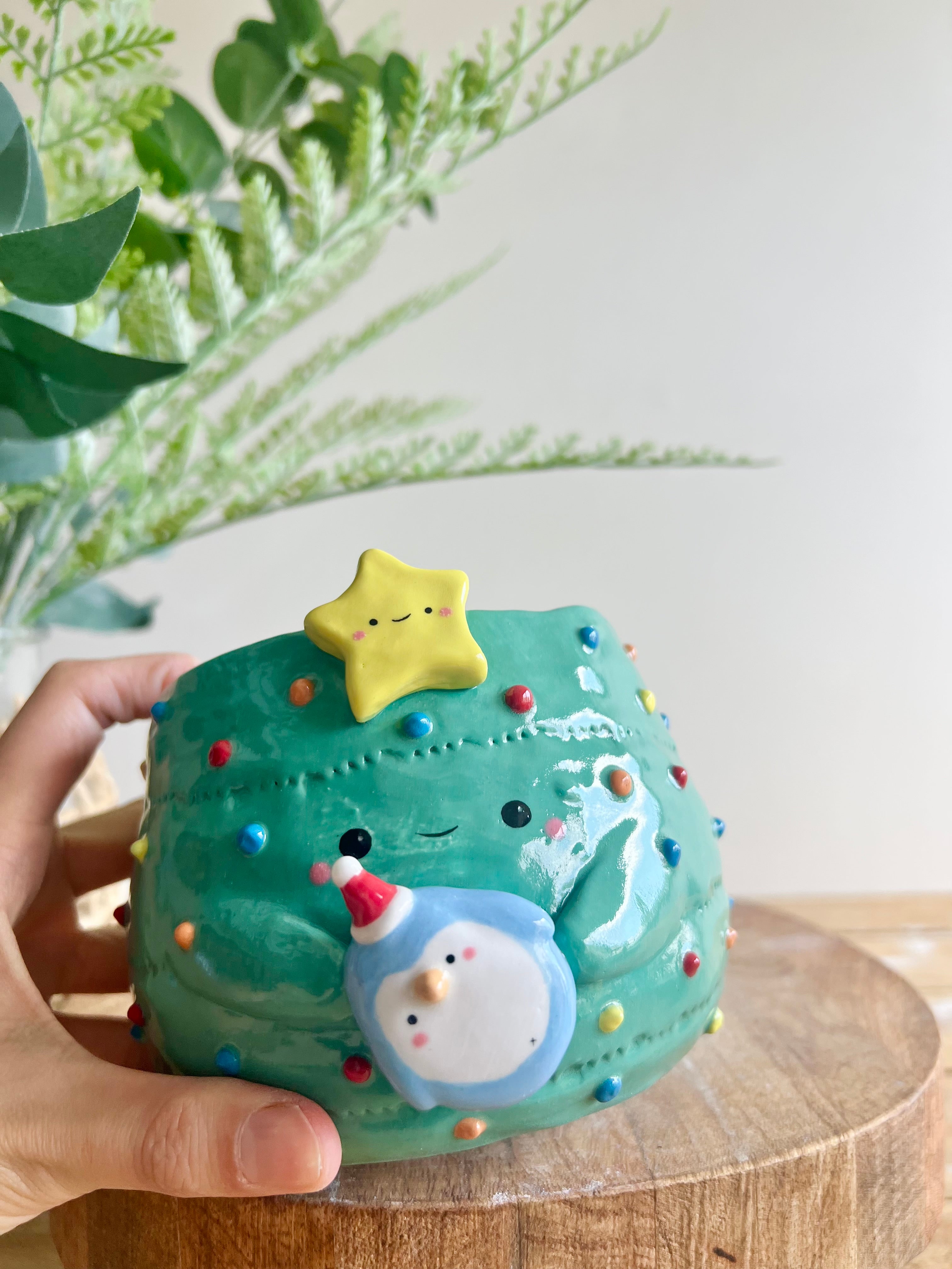 Christmas tree pot with penguin friend