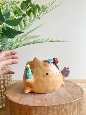 Gift bearing festive Ginger cat pot with Christmas tree friend