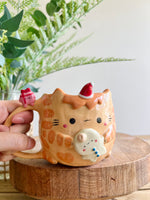 Ginger cat mug with gingerbread and present friend