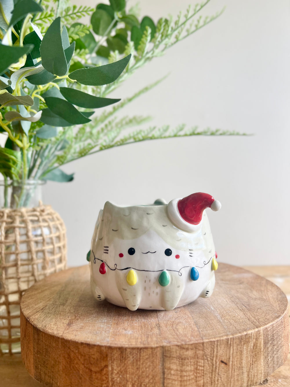 Festive grey cat pot adorned with Christmas lights, photo 6 of 11