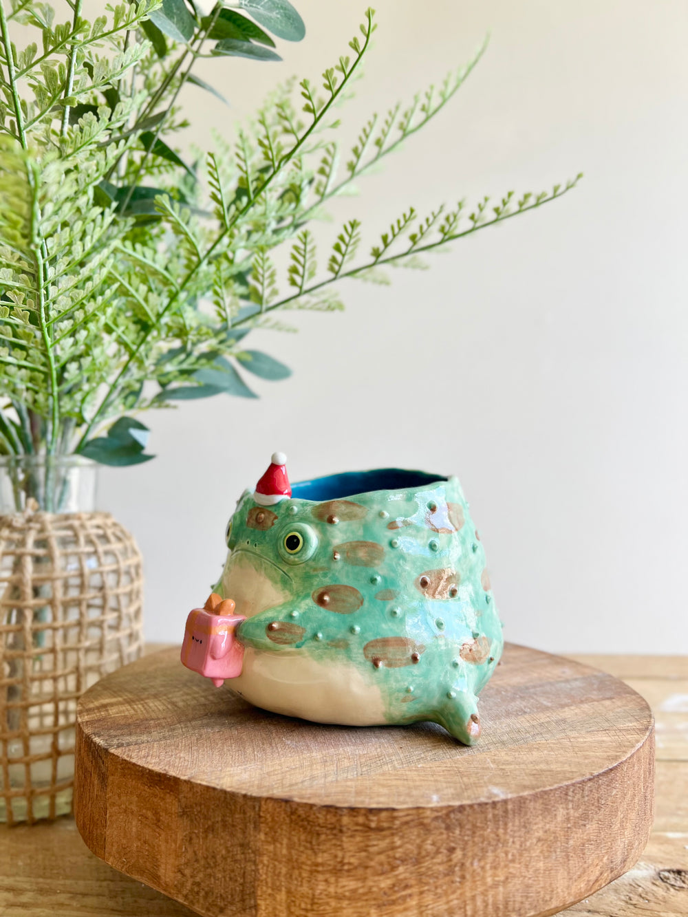Festive grumpy Froggo planter bearing gift, photo 7 of 15