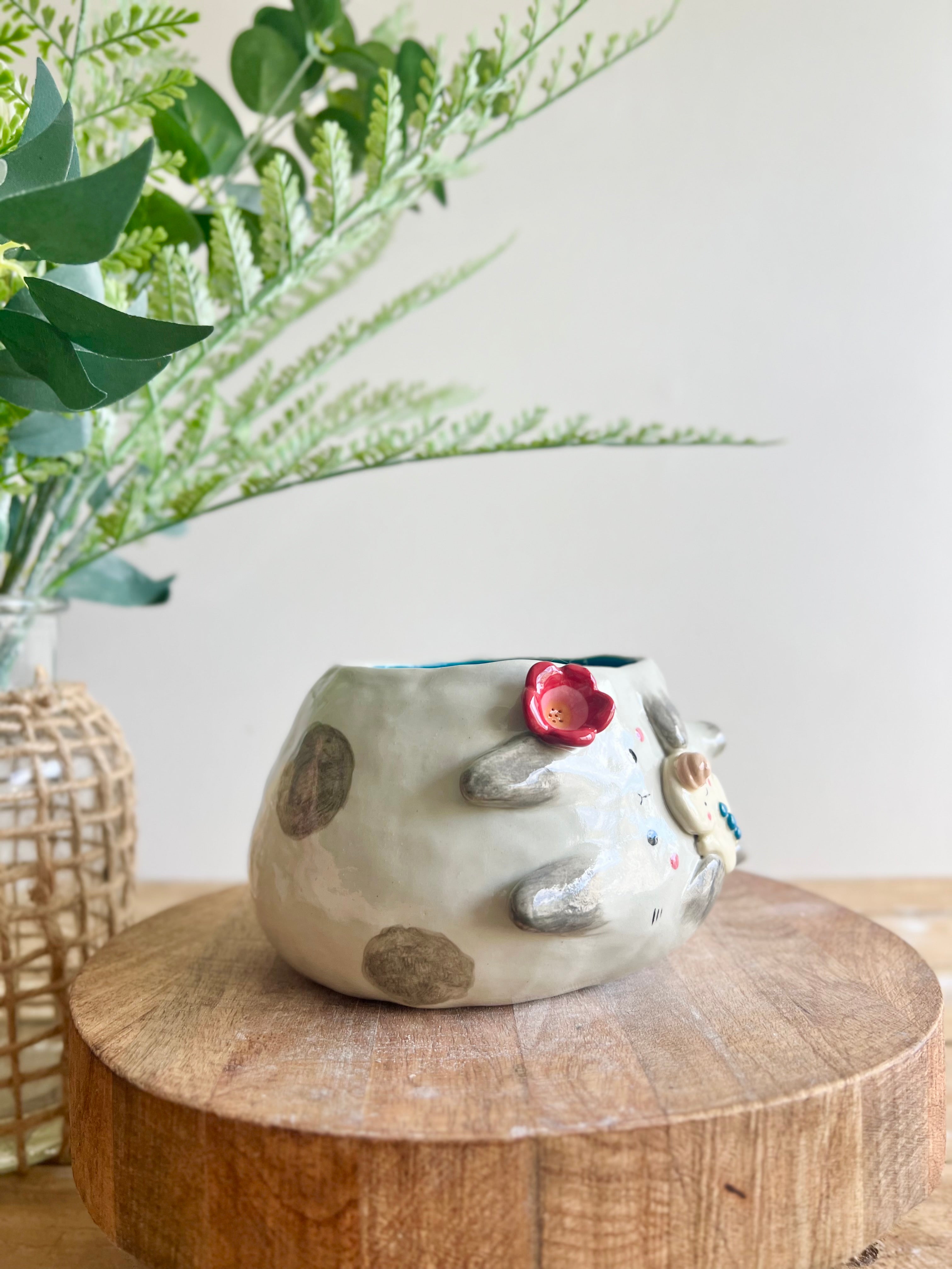 Flowery sideways bunny pot with gingerbread friend