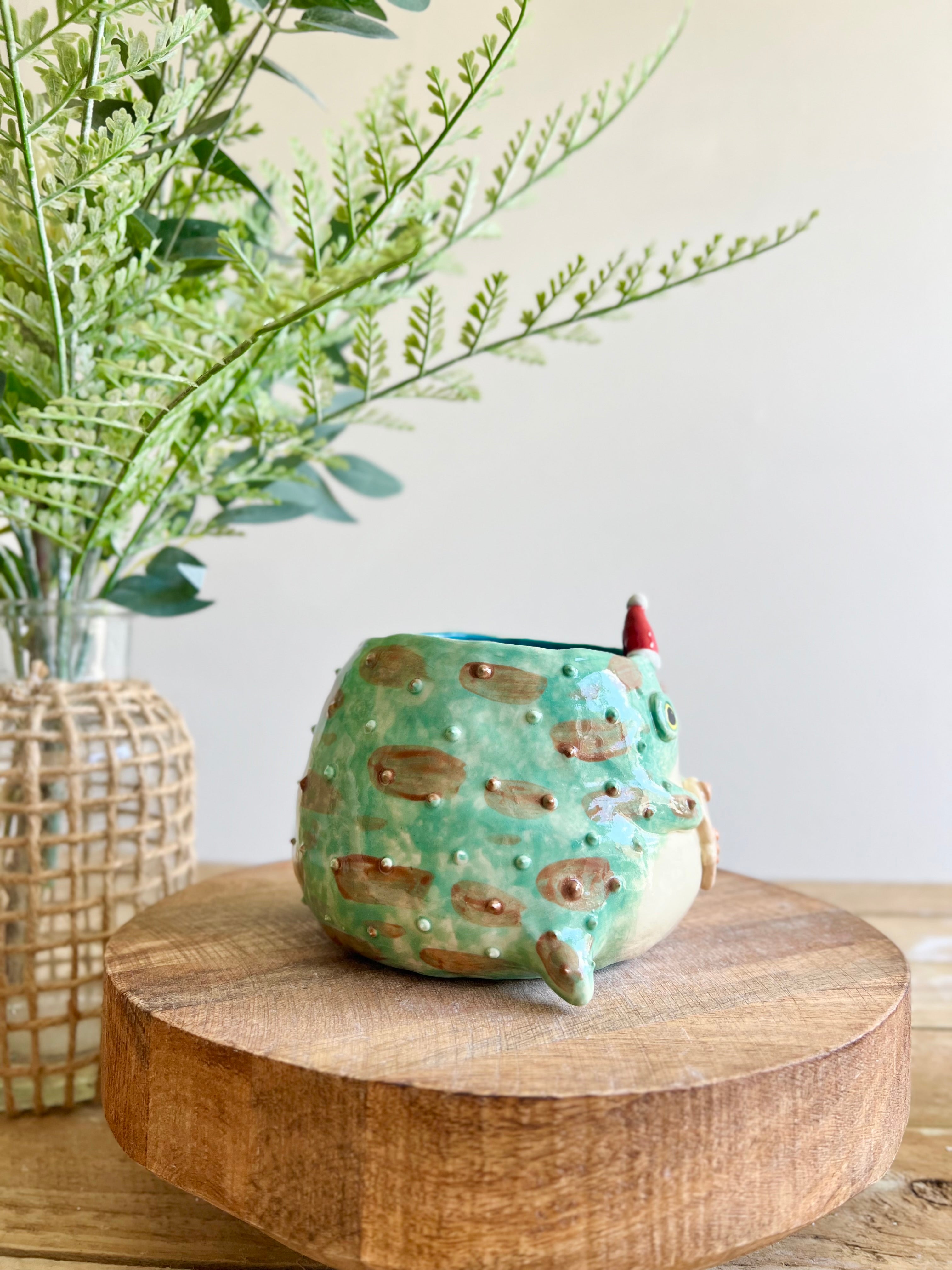 Festive grumpy Froggo planter with gingerbread friend