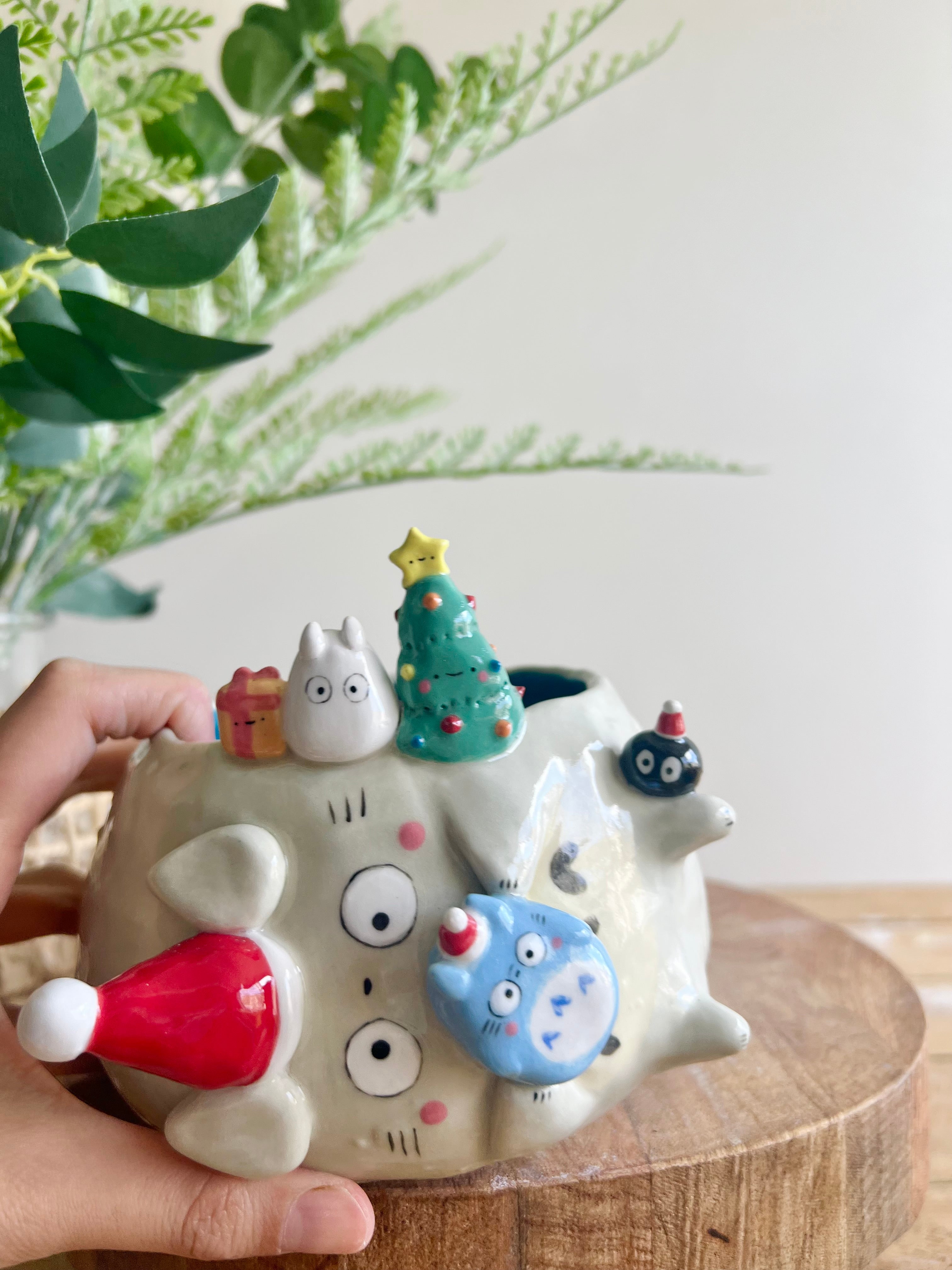 Festive sideways Totoro pot with Chibi Totoro friends