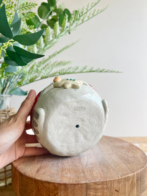 Festive grey cat pot with gingerbread friend