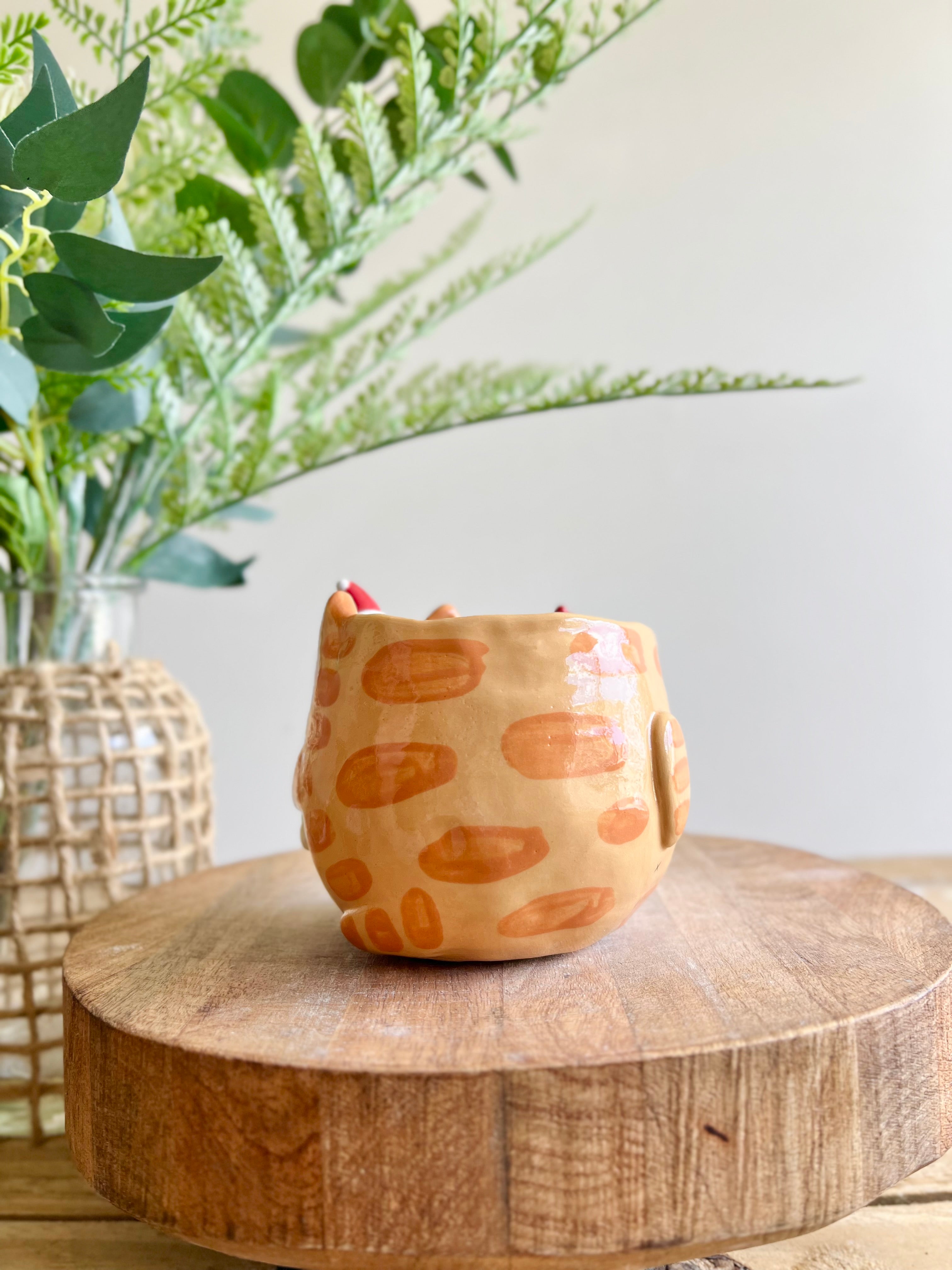 Ginger cat mug with gingerbread and present friend