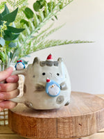 Festive bunny mug with penguin friends