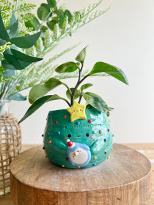 Christmas tree pot with penguin friend