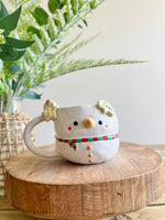 Snowman mug with gingerbread friends