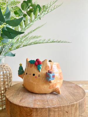 Gift bearing festive Ginger cat pot with Christmas tree friend