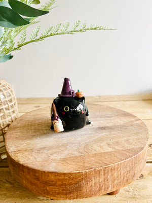 Black cat witch with broomstick and pumpkin friend bud vase