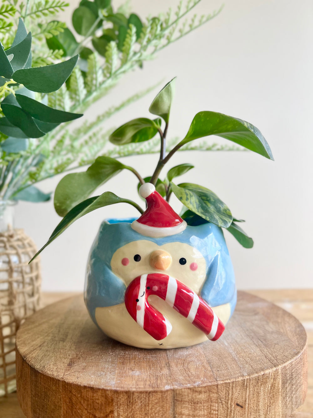 Festive penguin pot with giant candy cane friend, photo 1 of 9