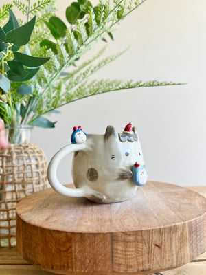 Festive bunny mug with penguin friends