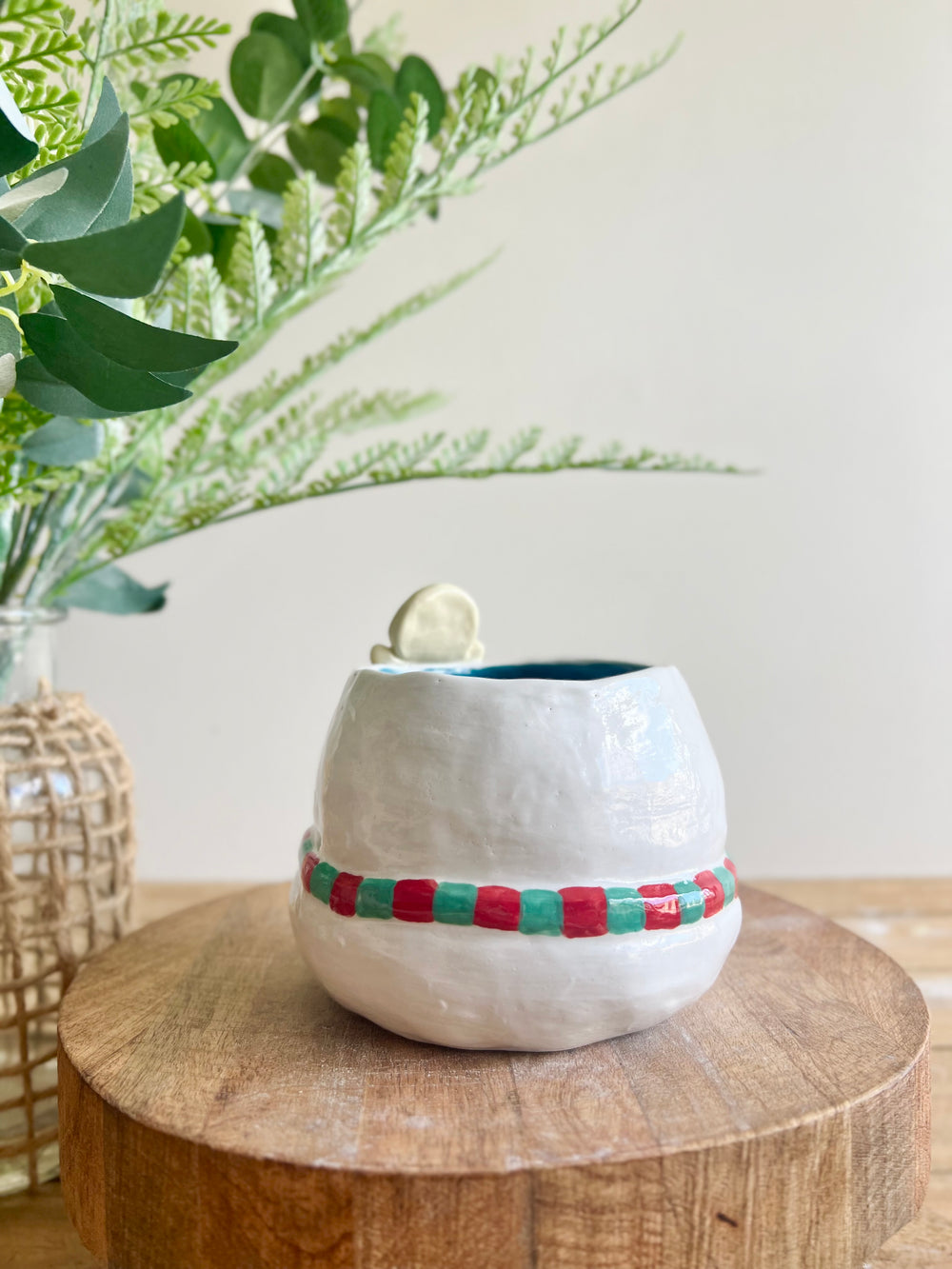 Festive snowman pot with gingerbread friend just chillin’ on its head, photo 4 of 11