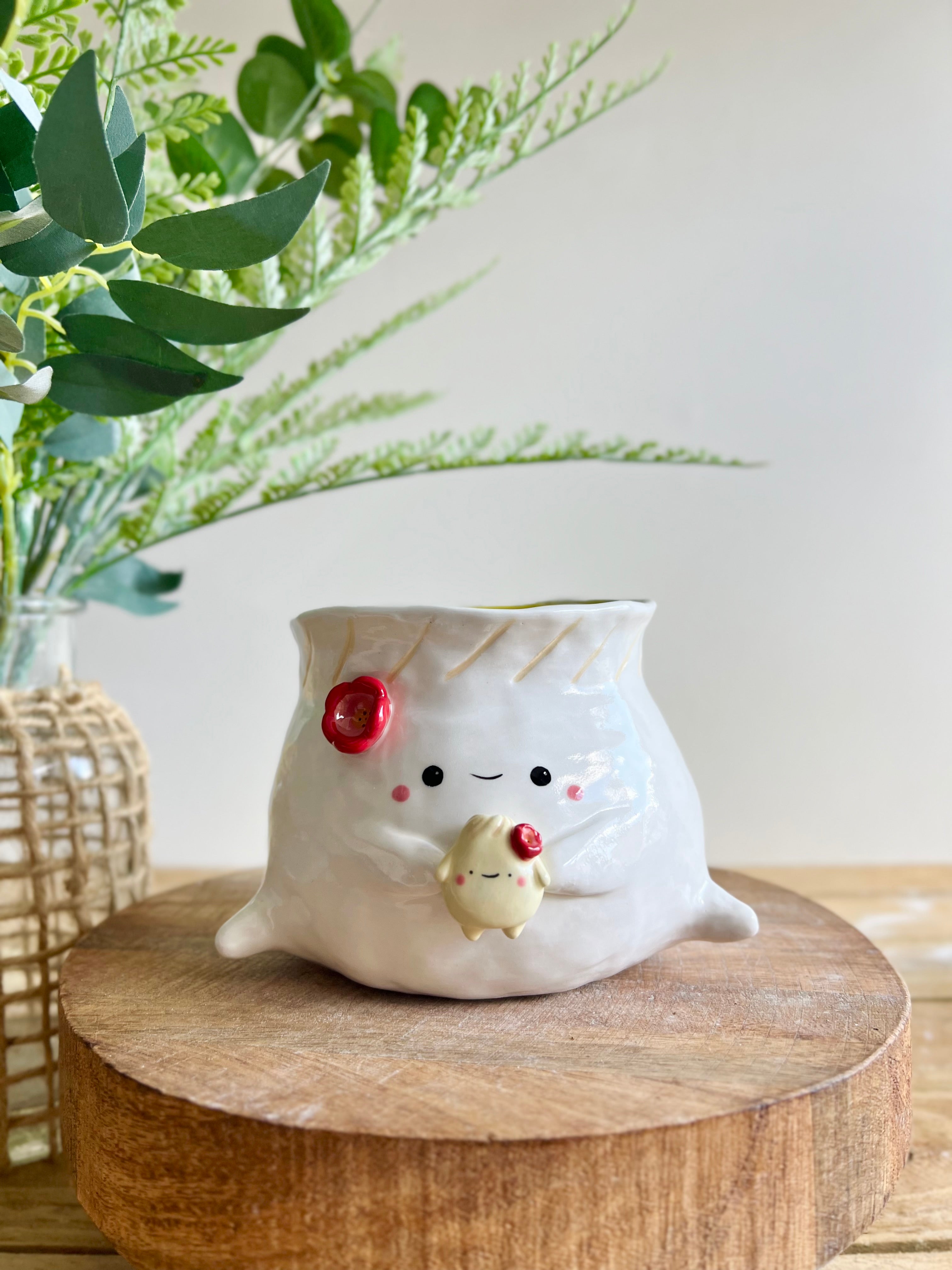 Flowery dumpling pot with baby dumpling