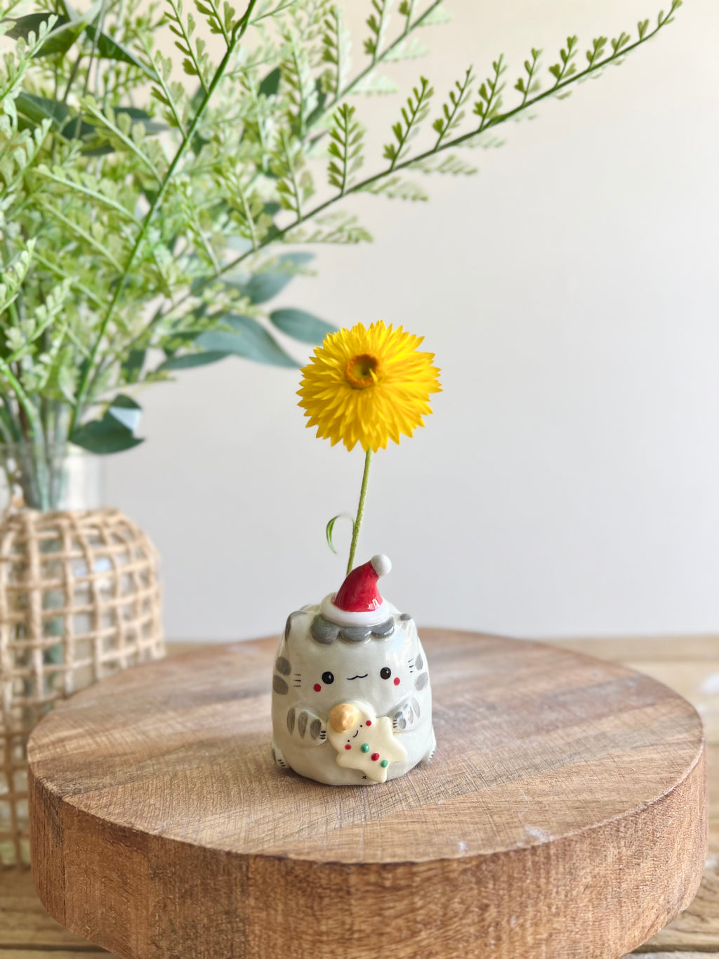 Festive grey cat with gingerbread friend bud vase