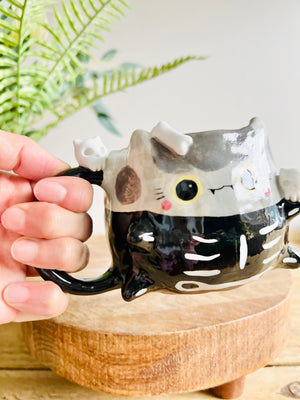 Skeleton kitty mug with cat skull friends