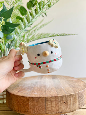 Snowman mug with gingerbread friends