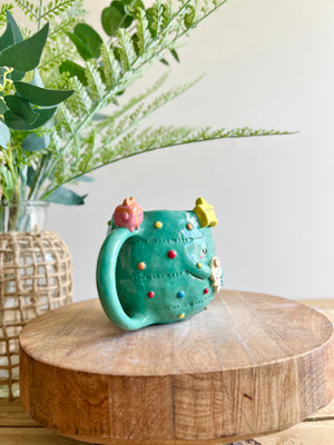 Christmas tree mug with gingerbread and present friend