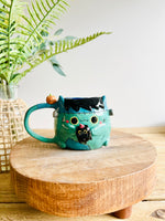 Franken-kitty mug with black cat friend