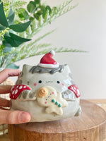 Festive grey cat pot with gingerbread friend