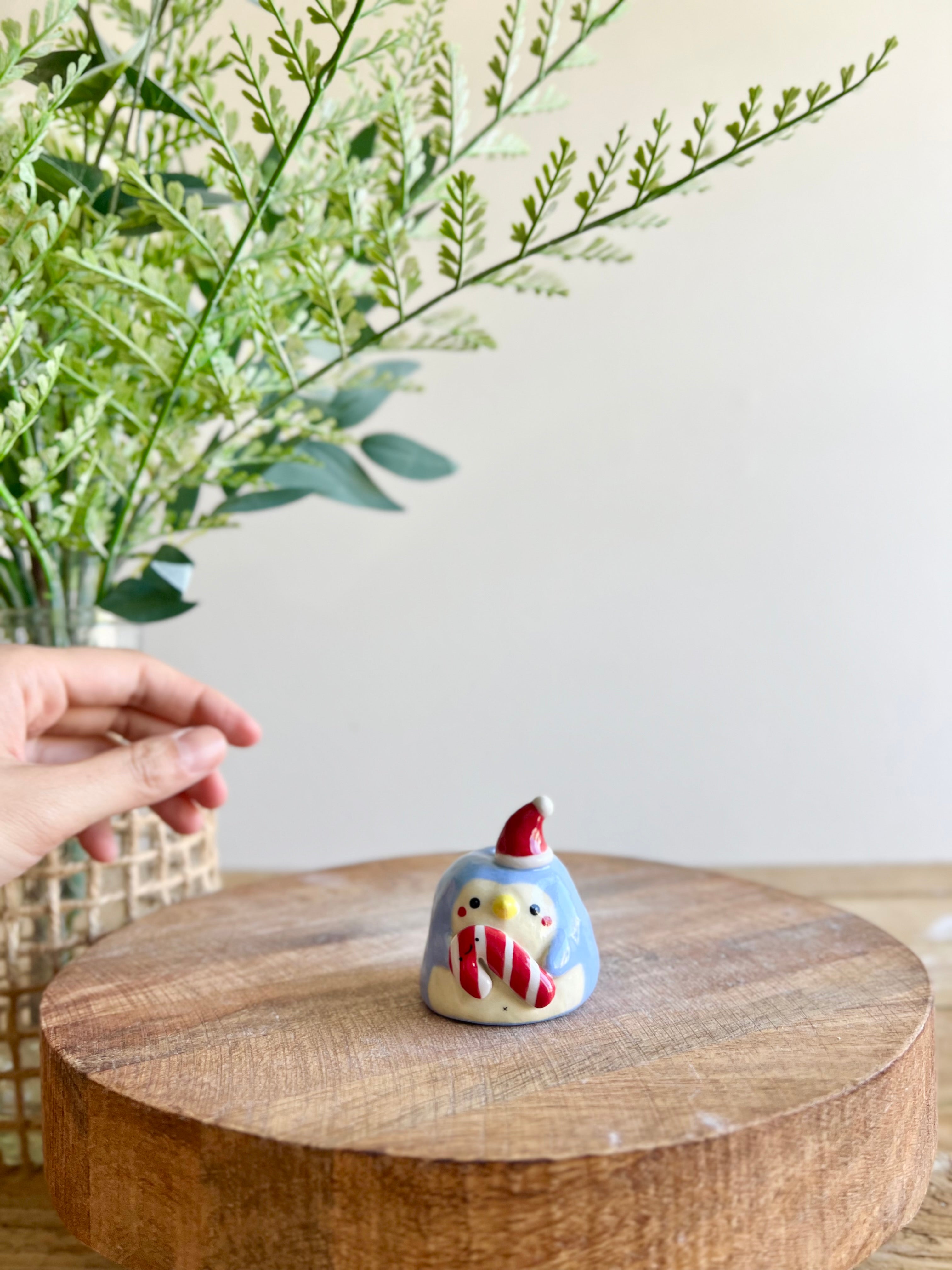 Mini festive penguin with candy cane friend bud vase