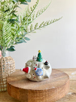 Festive sideways Totoro vase