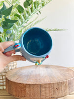 Festive Penguin mug with penguin baby and Christmas tree friend