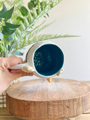 Snowman mug with gingerbread friends