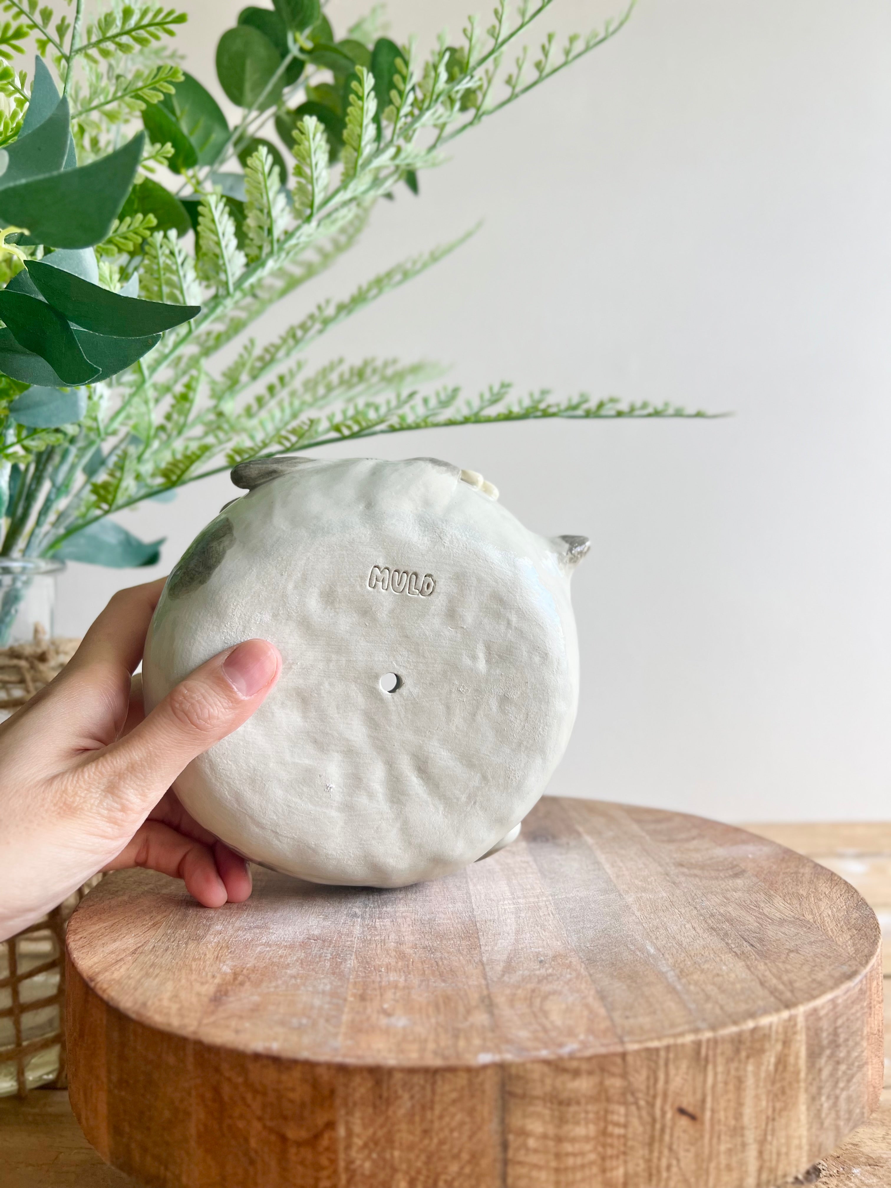 Flowery sideways bunny pot with gingerbread friend