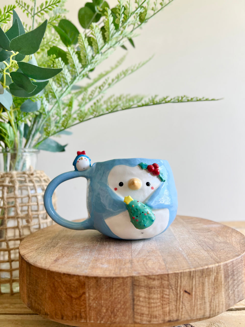 Festive Penguin mug with penguin baby and Christmas tree friend, photo 1 of 13