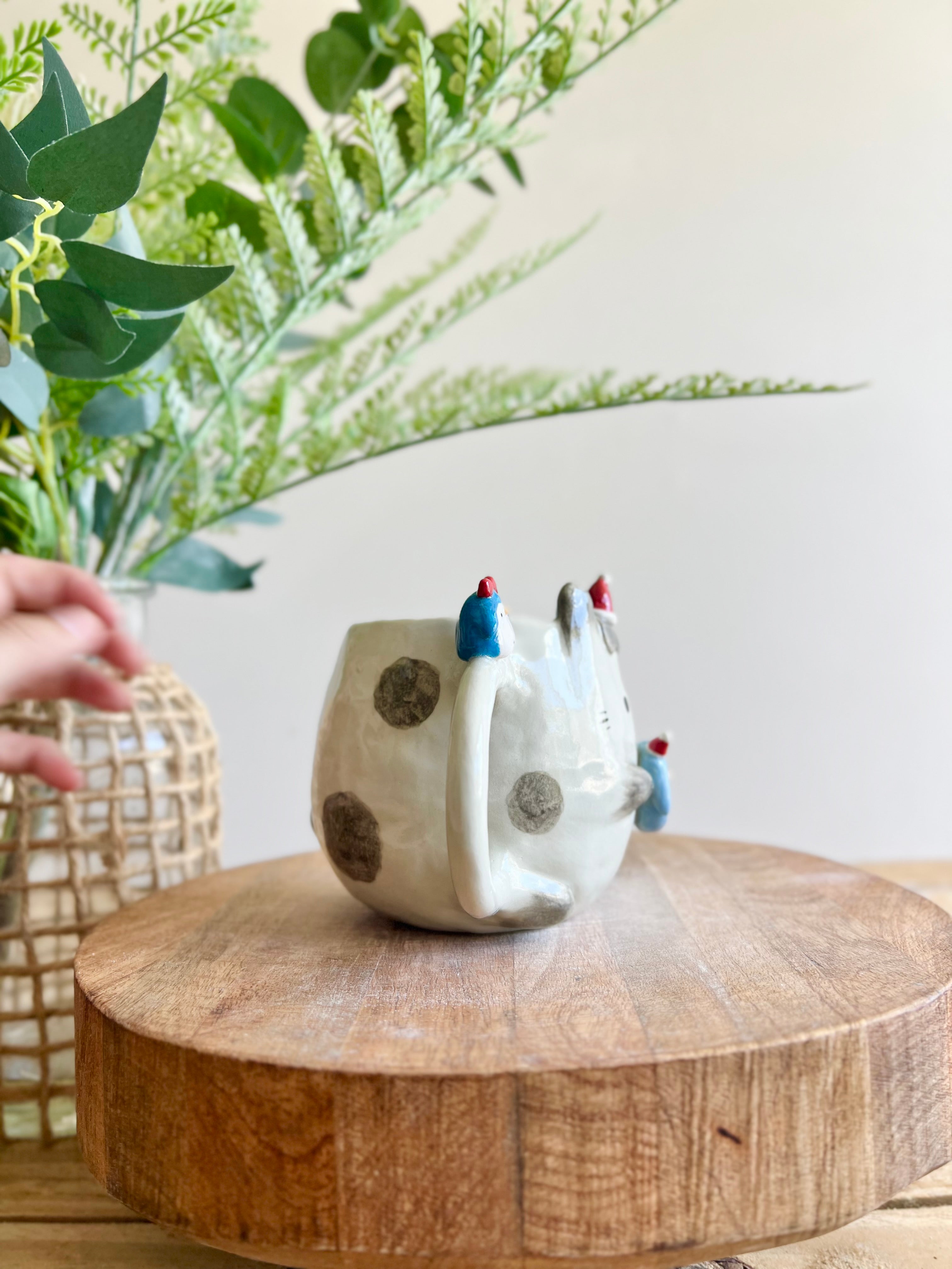 Festive bunny mug with penguin friends