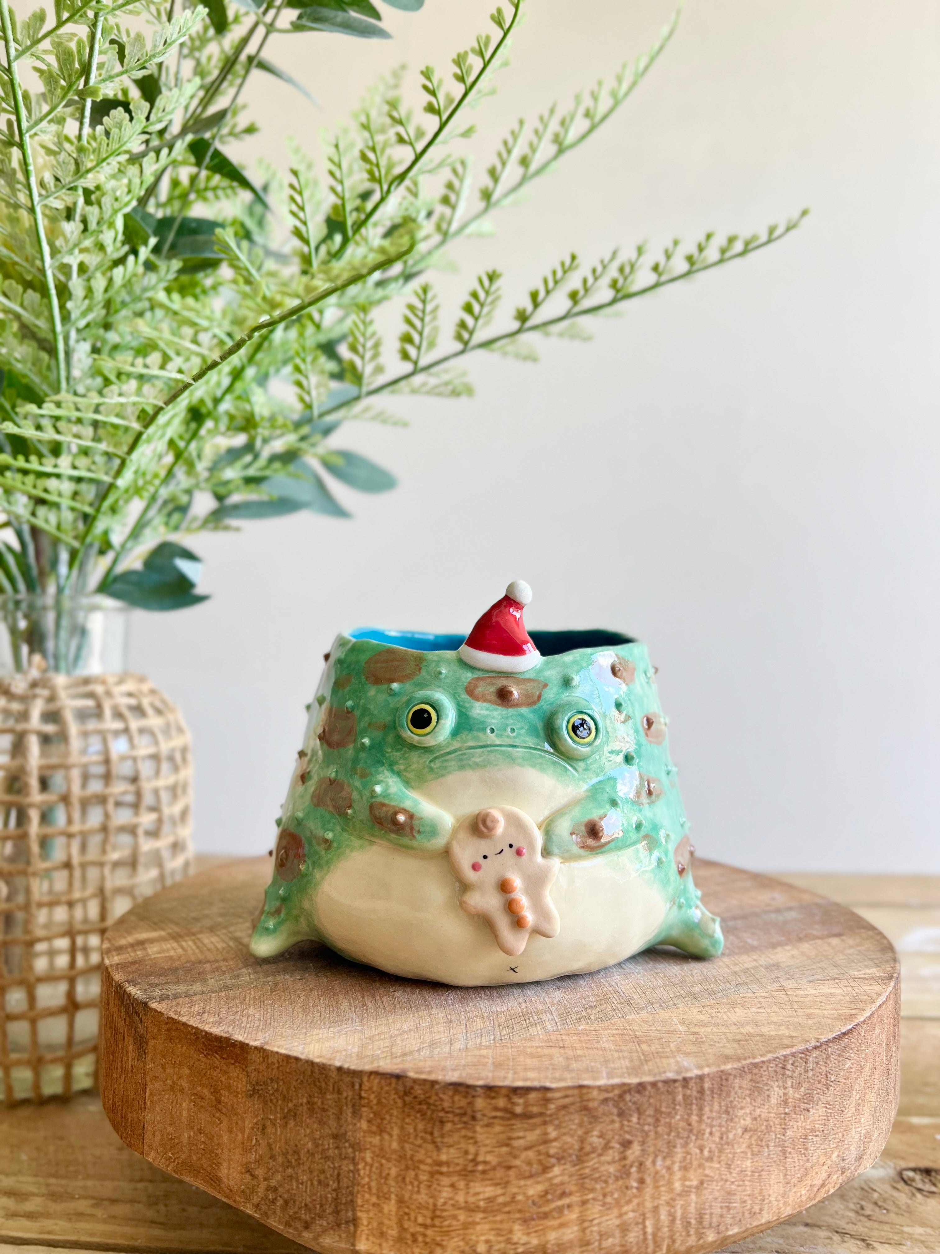 Festive grumpy Froggo planter with gingerbread friend