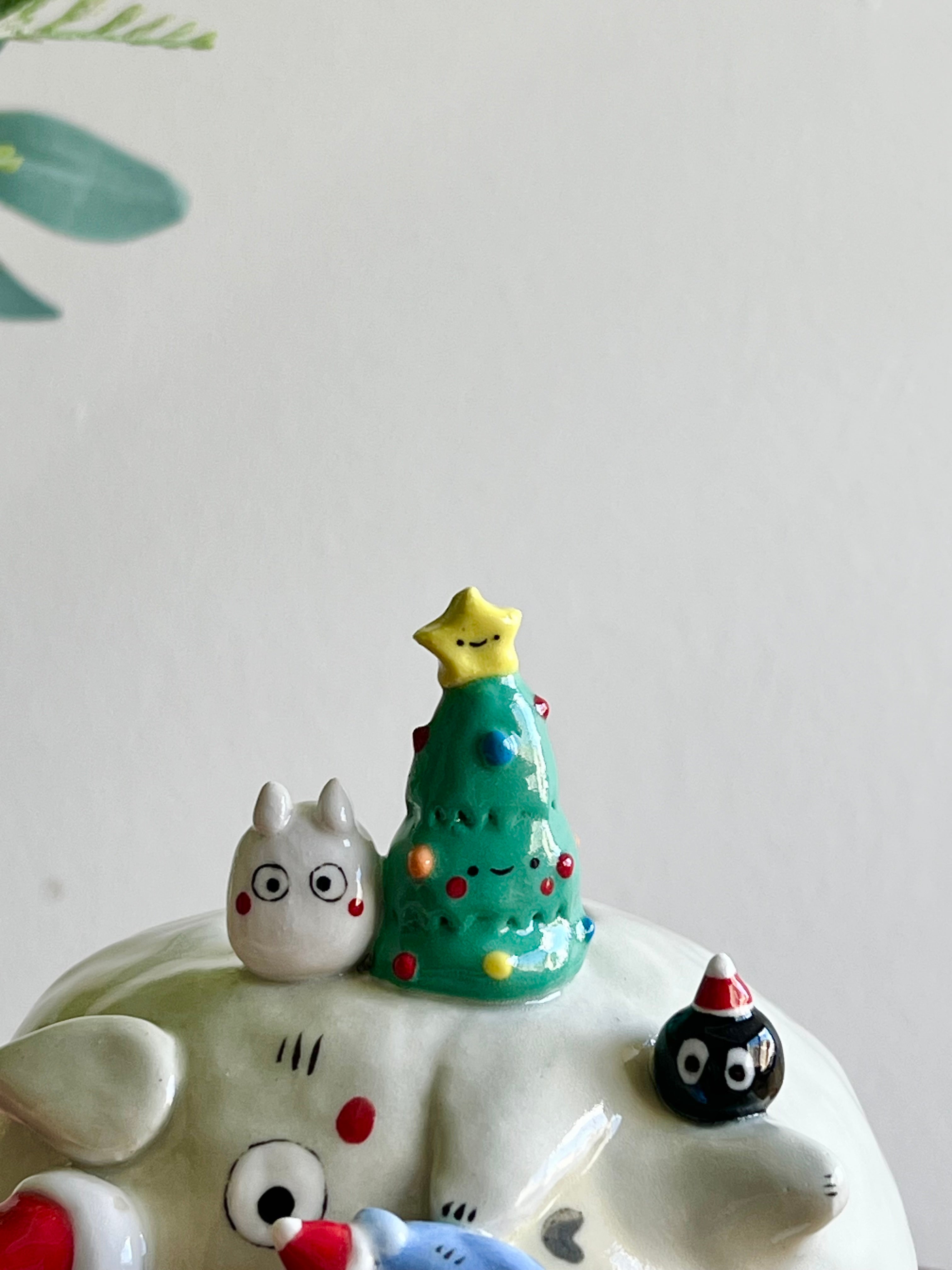 Festive sideways Totoro vase