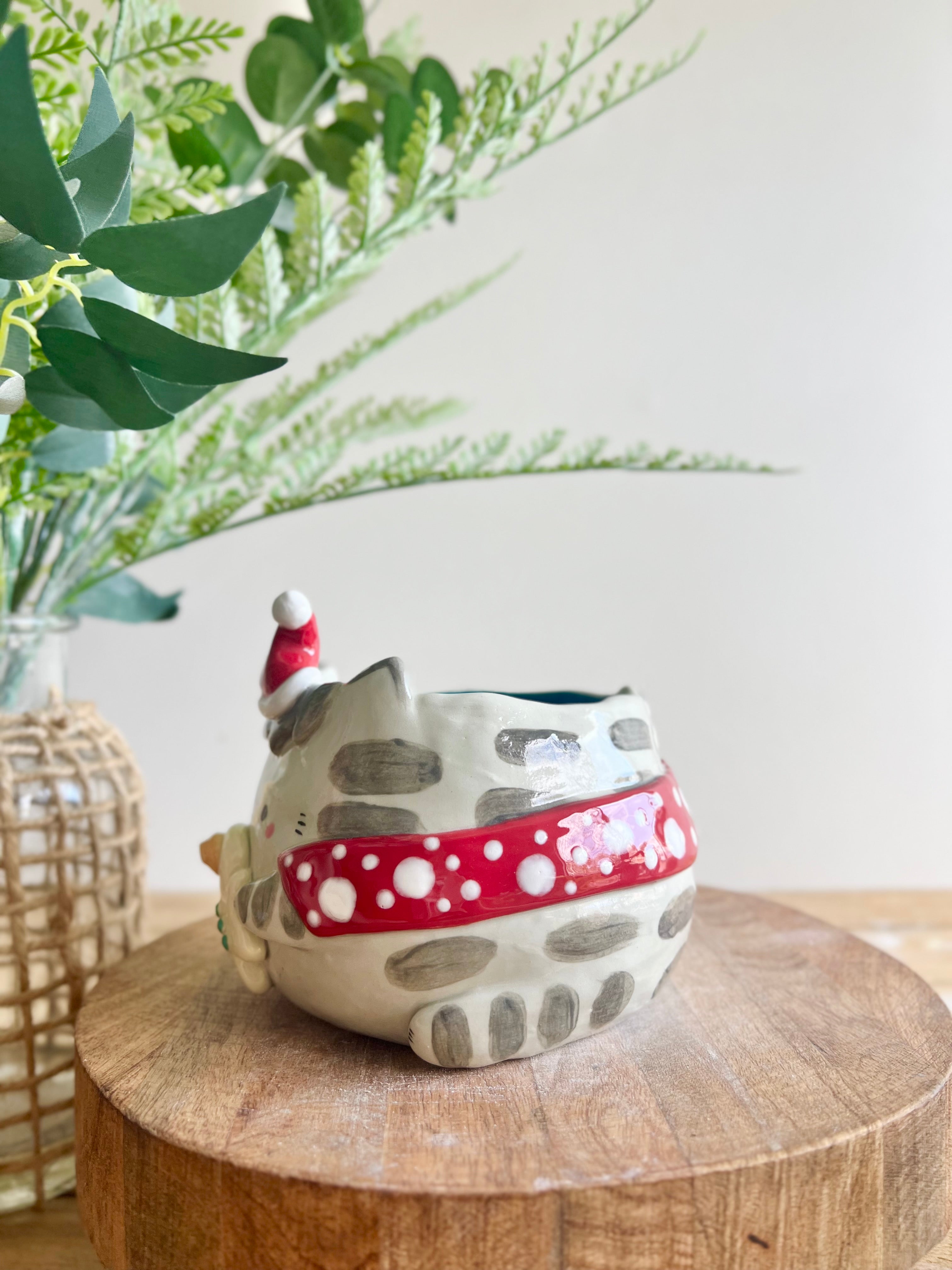 Festive grey cat pot with gingerbread friend