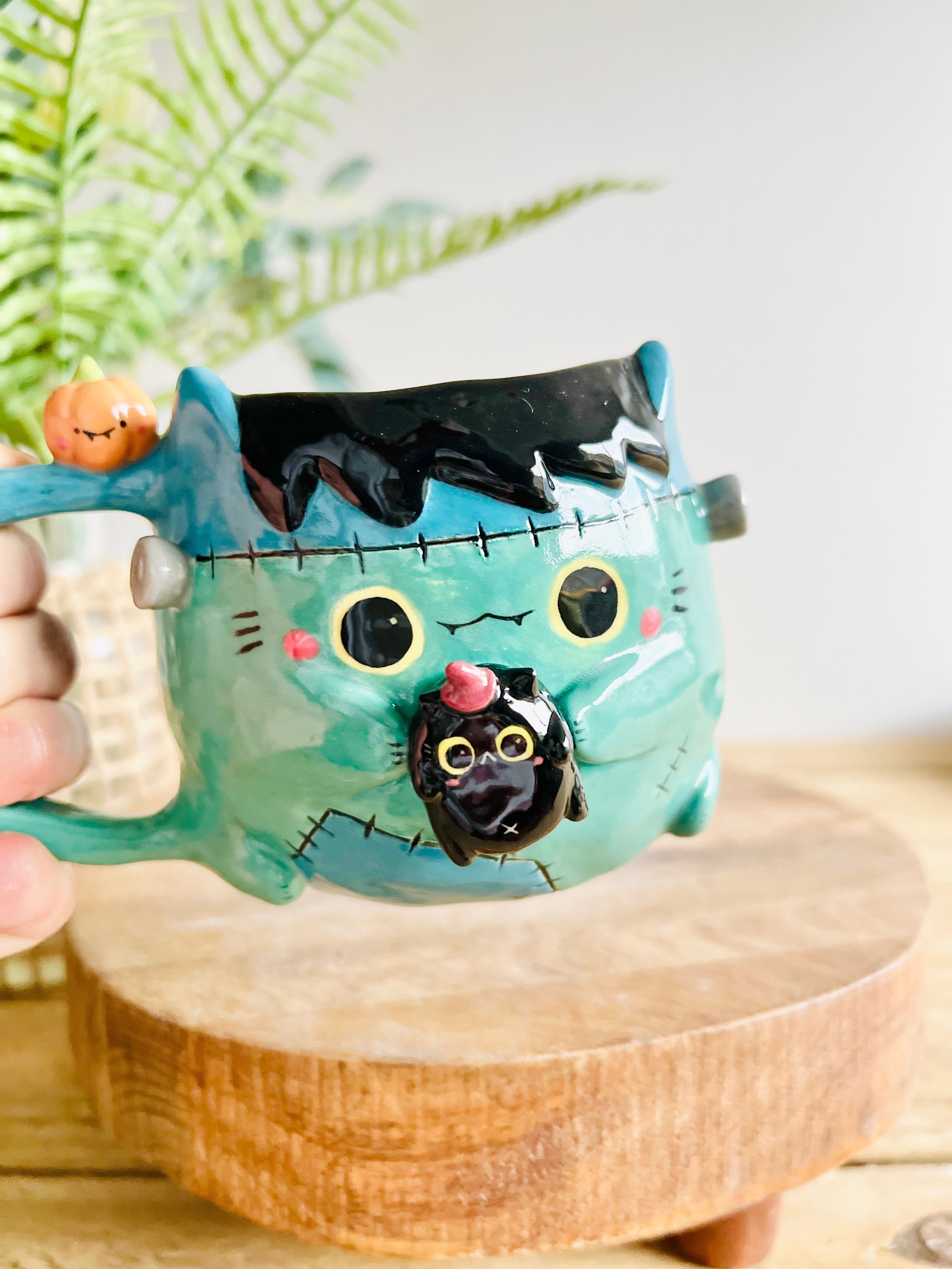 Franken-kitty mug with black cat friend