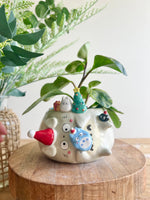 Festive sideways Totoro pot with Chibi Totoro friends