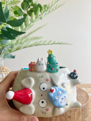 Festive sideways Totoro pot with Chibi Totoro friends