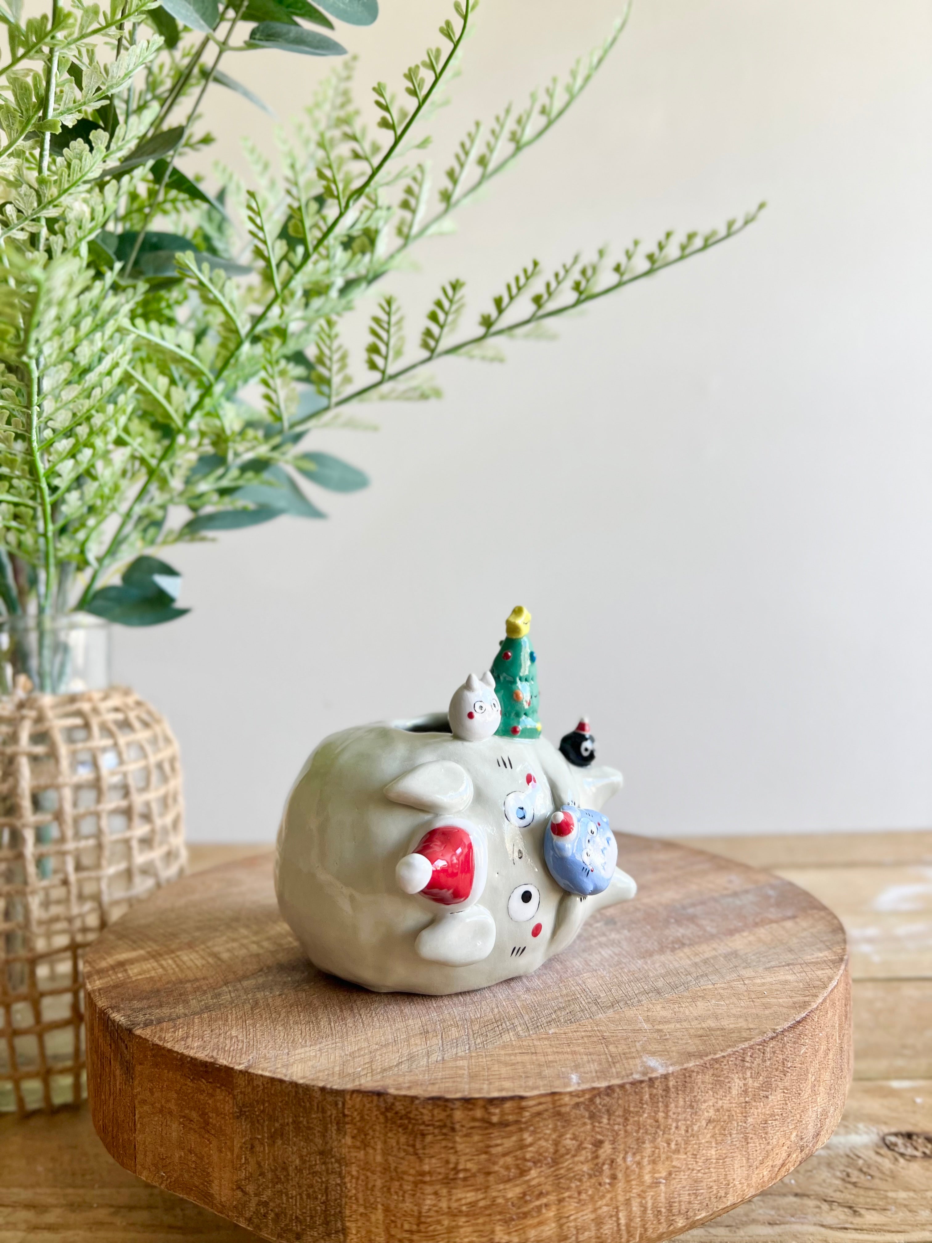 Festive sideways Totoro vase