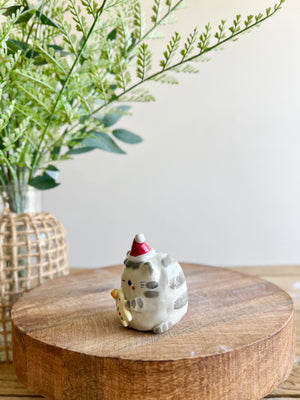 Festive grey cat with gingerbread friend bud vase