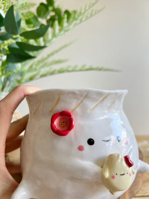 Flowery dumpling pot with baby dumpling