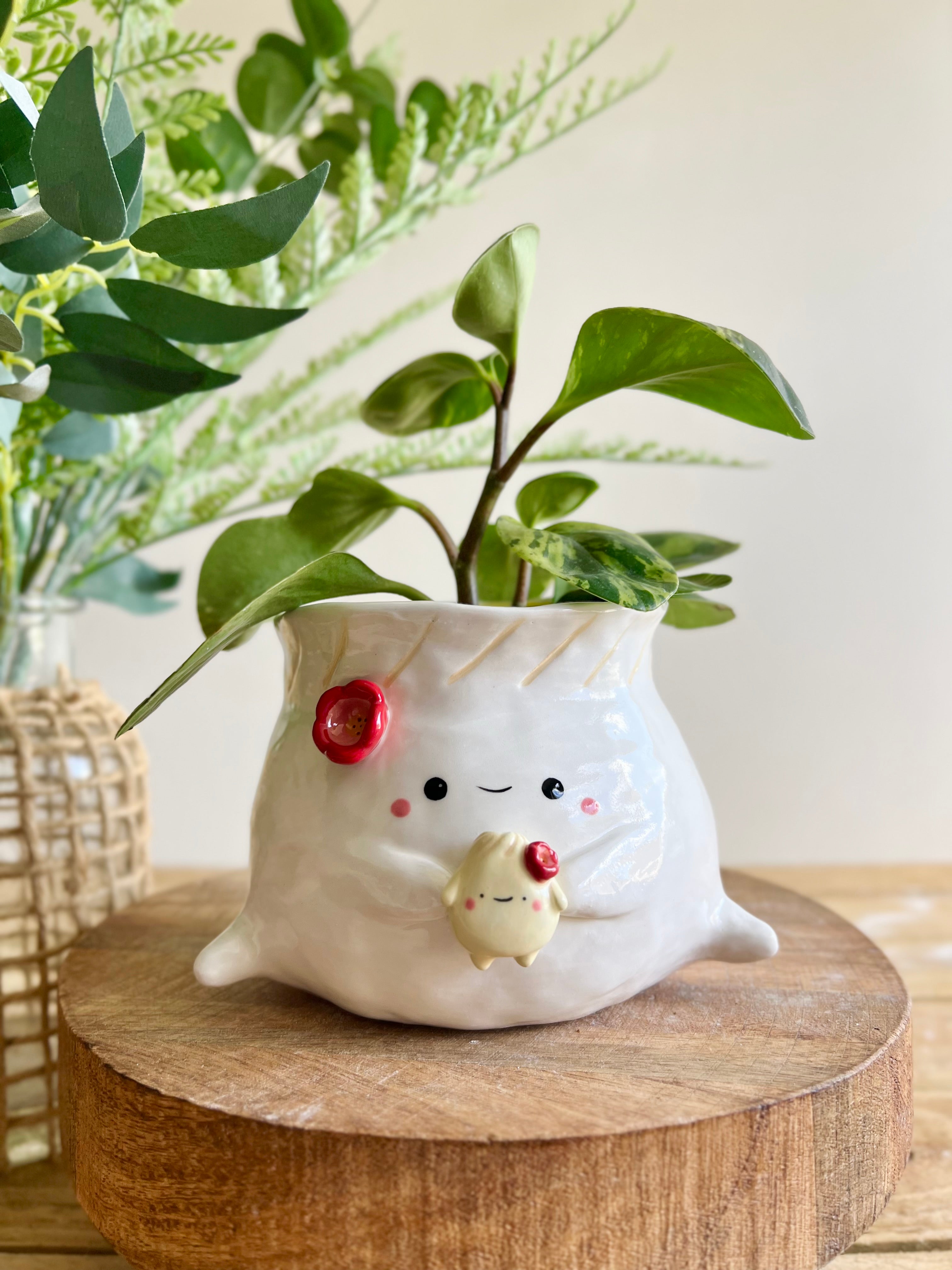 Flowery dumpling pot with baby dumpling