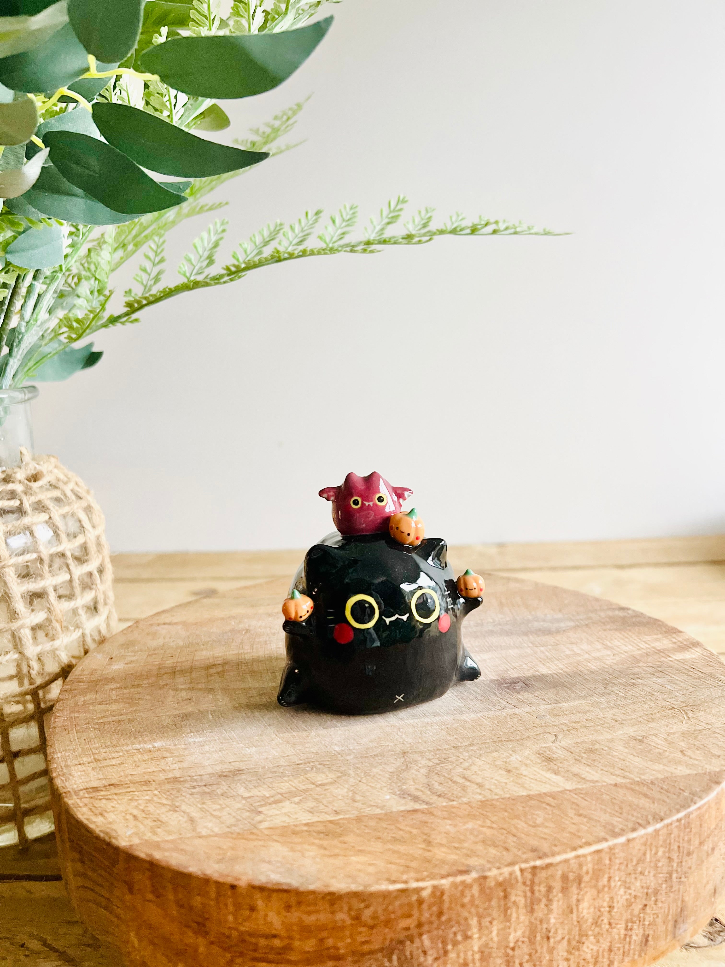 Black cat with bat and pumpkin friends bud vase