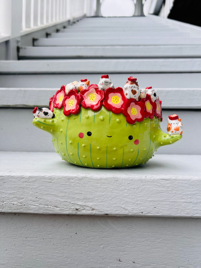 Big mama flowery cactus with cat friends