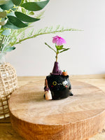 Black cat witch with broomstick and pumpkin friend bud vase