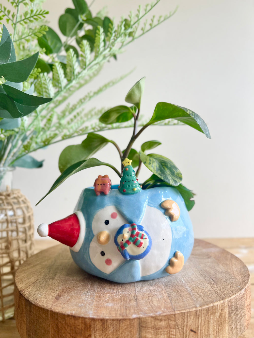 Festive sideways penguin pot with Christmas friends, photo 1 of 10